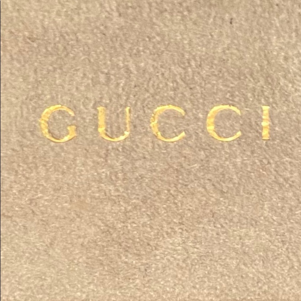 Gucci sunglass case.